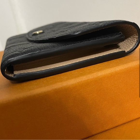 Authentic Louis Vuitton Emilie Monogram Empreinte Leather Wallet in black - Picture 9 of 9